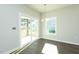 Bright dining room with hardwood flooring, modern lighting, and a sliding glass door at 117 Ambergate Ct, Rocky Mount, NC 27804