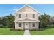 Charming two-story home with a manicured lawn and inviting front porch at 117 Ambergate Ct, Rocky Mount, NC 27804