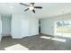 Open concept living room features hardwood flooring, ceiling fan, and great natural light at 117 Ambergate Ct, Rocky Mount, NC 27804