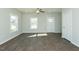 Spacious living room with abundant natural light and modern ceiling fan at 117 Ambergate Ct, Rocky Mount, NC 27804