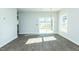 Dining area with hardwood flooring, modern lighting, and sliding glass door at 117 Ambergate Ct, Rocky Mount, NC 27804
