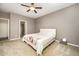 Comfortable bedroom with a ceiling fan, neutral walls, and carpeted floor at 1201 Pleasant Falls Ct, Wake Forest, NC 27587