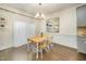 Bright dining room featuring hardwood floors, wainscoting, and a stylish chandelier at 1201 Pleasant Falls Ct, Wake Forest, NC 27587