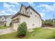 View of the house with attached garage and well maintained lawn at 1201 Pleasant Falls Ct, Wake Forest, NC 27587