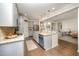 Well-lit kitchen with an island, granite countertops, stainless steel appliances, and open layout at 1201 Pleasant Falls Ct, Wake Forest, NC 27587