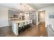 Modern kitchen with granite countertops, stainless steel appliances, and a central island with bar seating at 1201 Pleasant Falls Ct, Wake Forest, NC 27587