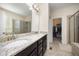Bathroom featuring granite countertops, double sinks, a glass shower, and a walk-in closet at 1201 Pleasant Falls Ct, Wake Forest, NC 27587