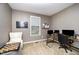 Cozy home office featuring neutral walls, comfortable seating, and natural light from window at 1201 Pleasant Falls Ct, Wake Forest, NC 27587