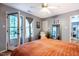 Cozy bedroom with an orange bedspread and a door leading to the outside at 121 Westview Dr # 22, Carrboro, NC 27510