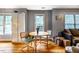 Bright dining area adjacent to the living room, featuring a wooden table and chairs at 121 Westview Dr # 22, Carrboro, NC 27510