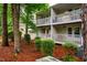 A lovely two-story home showcases beautiful balconies and well-maintained landscaping at 121 Westview Dr # 22, Carrboro, NC 27510