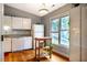 Bright kitchen with white cabinetry, modern appliances, and natural light from a window at 121 Westview Dr # 22, Carrboro, NC 27510
