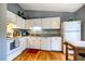Bright kitchen featuring white cabinets, wood floors and granite countertops at 121 Westview Dr # 22, Carrboro, NC 27510