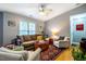 Comfortable living room with a ceiling fan, windows, and a stylish area rug at 121 Westview Dr # 22, Carrboro, NC 27510