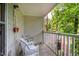 Comfortable screened porch with seating, creating an ideal spot for outdoor relaxation and enjoying the wooded view at 121 Westview Dr # 22, Carrboro, NC 27510
