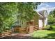 Expansive backyard with a wooden fence and covered deck, providing privacy and a tranquil outdoor living space at 122 N Fern Abbey Ln, Cary, NC 27518