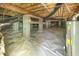 Unfinished basement with concrete block supports and a white moisture barrier at 122 N Fern Abbey Ln, Cary, NC 27518