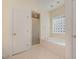 Relaxing bathroom featuring a soaking tub, separate shower, and bright window for natural light at 122 N Fern Abbey Ln, Cary, NC 27518