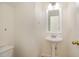 Bathroom with a pedestal sink and toilet at 122 N Fern Abbey Ln, Cary, NC 27518