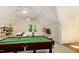 Spacious bonus room with a pool table, ample lighting, and comfortable seating, perfect for entertaining guests at 122 N Fern Abbey Ln, Cary, NC 27518