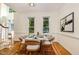 Elegant dining room with hardwood floors and a modern table setting for sophisticated dining at 122 N Fern Abbey Ln, Cary, NC 27518