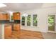 Kitchen featuring hardwood floors, wooden cabinets, and stainless steel appliances at 122 N Fern Abbey Ln, Cary, NC 27518