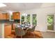 Cozy kitchen nook with a small dining table and a view of the outside at 122 N Fern Abbey Ln, Cary, NC 27518