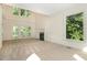 Spacious living room with vaulted ceilings, a fireplace, carpet, and natural light at 122 N Fern Abbey Ln, Cary, NC 27518