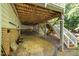 View of underside of deck with stairs, lattice, brick foundation, and gravel at 122 N Fern Abbey Ln, Cary, NC 27518