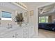 Primary bathroom with dual sinks and a view to the primary bedroom at 1224 Wedgeland Dr, Raleigh, NC 27615