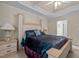 Spacious bedroom featuring a tray ceiling and direct access to the bathroom at 1224 Wedgeland Dr, Raleigh, NC 27615