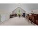 Large bonus room with a piano, desk, chair, and a bright window at 1224 Wedgeland Dr, Raleigh, NC 27615