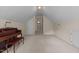 Large bonus room with a piano and doorway to another room at 1224 Wedgeland Dr, Raleigh, NC 27615