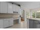 Kitchen with ample storage, a built-in desk area, and backyard access at 1224 Wedgeland Dr, Raleigh, NC 27615