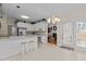 Bright kitchen area with white cabinets and easy access to the backyard at 1224 Wedgeland Dr, Raleigh, NC 27615