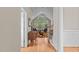 Open-concept living room with vaulted ceilings, large windows, and a colorful rug at 1224 Wedgeland Dr, Raleigh, NC 27615