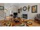 Comfortable living room with fireplace, hardwood floors, and open entryway at 1224 Wedgeland Dr, Raleigh, NC 27615
