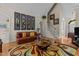 Spacious living room with comfortable seating, a colorful rug, and hardwood floors at 1224 Wedgeland Dr, Raleigh, NC 27615