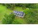 Aerial view of a beautiful home with lush landscaping and a well-maintained yard at 124 Windmere Dr, Angier, NC 27501