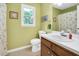Bathroom featuring single sink vanity and combination shower/tub at 124 Windmere Dr, Angier, NC 27501