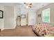 Bedroom featuring carpet flooring, a closet, and a window at 124 Windmere Dr, Angier, NC 27501
