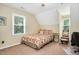 Bedroom features a ceiling fan, a window, and carpet flooring at 124 Windmere Dr, Angier, NC 27501