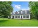 Charming two-story home featuring a well-manicured lawn and classic curb appeal at 124 Windmere Dr, Angier, NC 27501