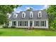 Charming two-story home featuring a well-manicured lawn and classic curb appeal at 124 Windmere Dr, Angier, NC 27501