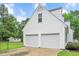 Attached two-car garage with ample parking space and a well-maintained exterior at 124 Windmere Dr, Angier, NC 27501