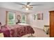 Bedroom with carpet flooring and multiple windows providing ample natural light at 124 Windmere Dr, Angier, NC 27501