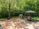 Backyard with patio featuring an outdoor grill and dining set at 1514 John Jones Rd, Bahama, NC 27503