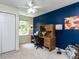 Bedroom features a built-in desk and ample natural light from the window at 1514 John Jones Rd, Bahama, NC 27503