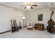 Finished bonus room featuring neutral carpet, ceiling fan, and unique decor at 1514 John Jones Rd, Bahama, NC 27503