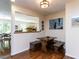 Cozy dining area with built-in bench seating and a view to the living room, perfect for Gathering meals at 1514 John Jones Rd, Bahama, NC 27503